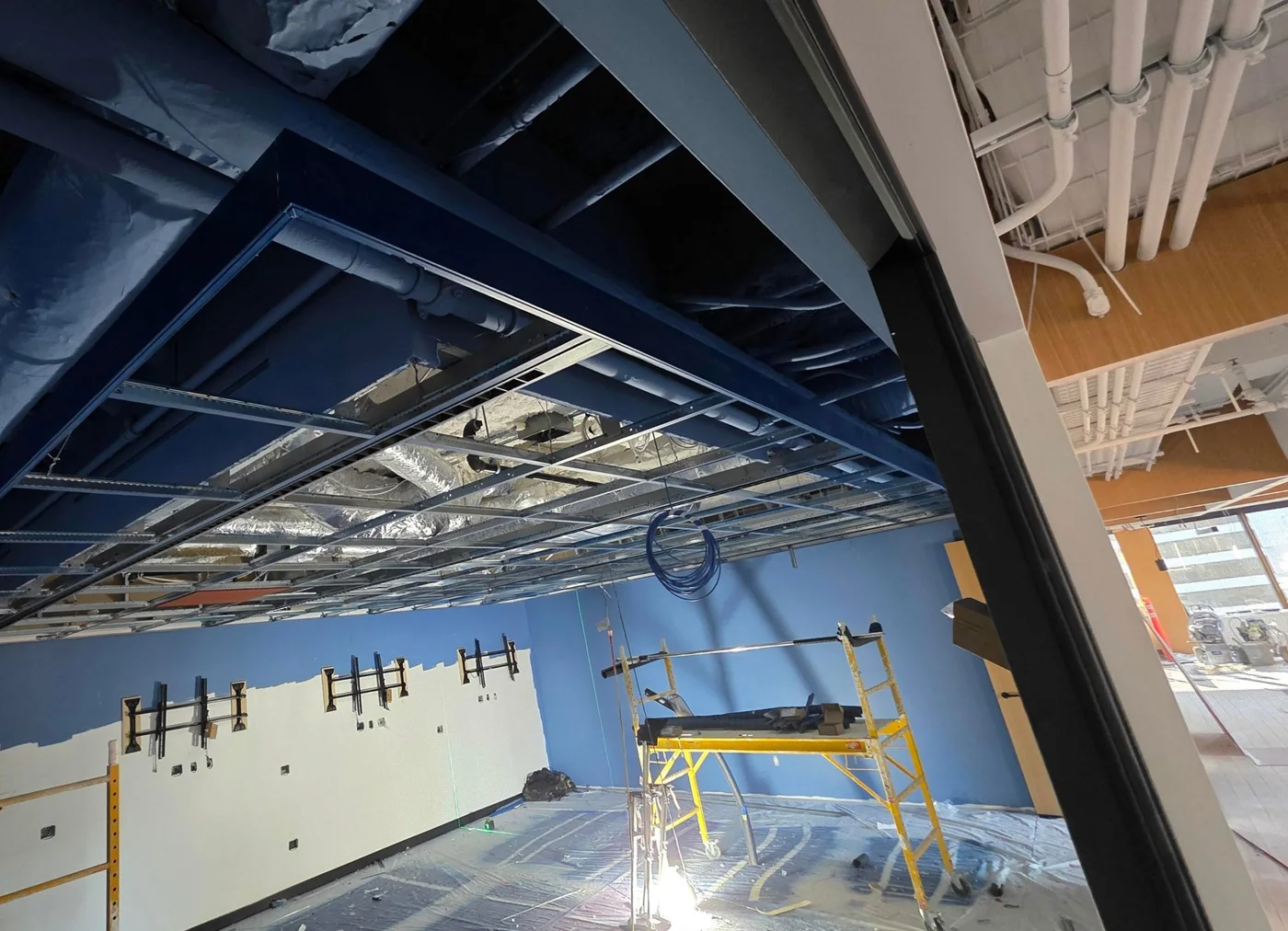 Floating T-bar ceiling at Autodesk, Vancouver — project photograph supplied by Mason McKenzie / Rambo
